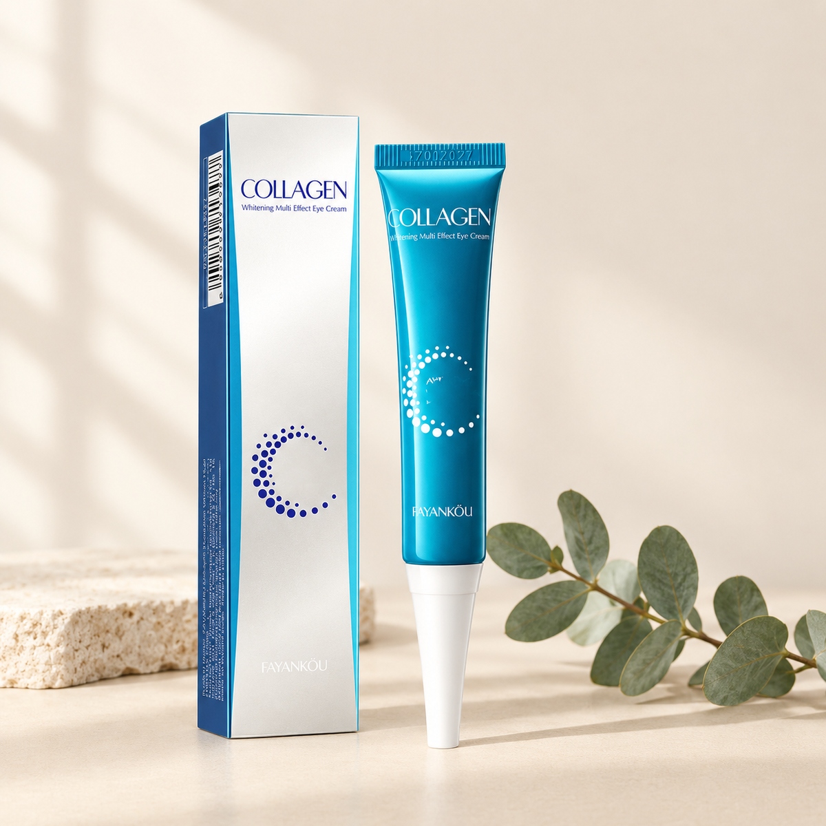 Collagen eye cream tube and box with eucalyptus on a cream background